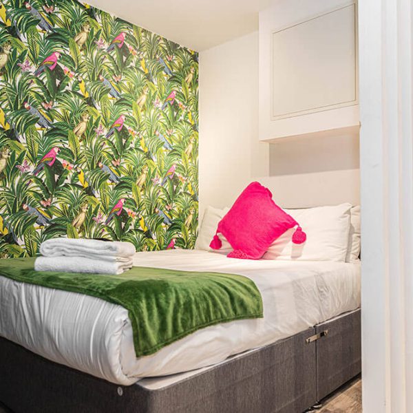 image of bed and pillows in phoenix collection apartment